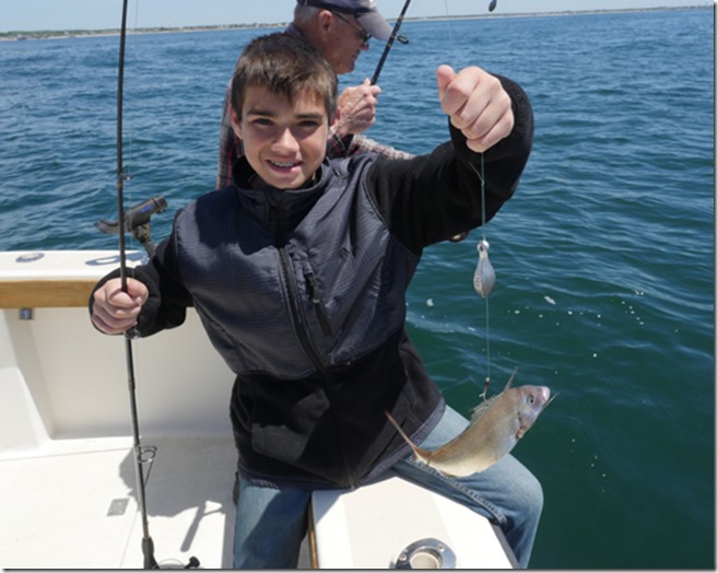 matt snags a scup on his ri fishing carter aces wild